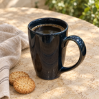 Tall Dark Glossy Mug — in-use scene with styling props