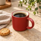 Red Mug with Cream Interior — filled with coffee; styling props